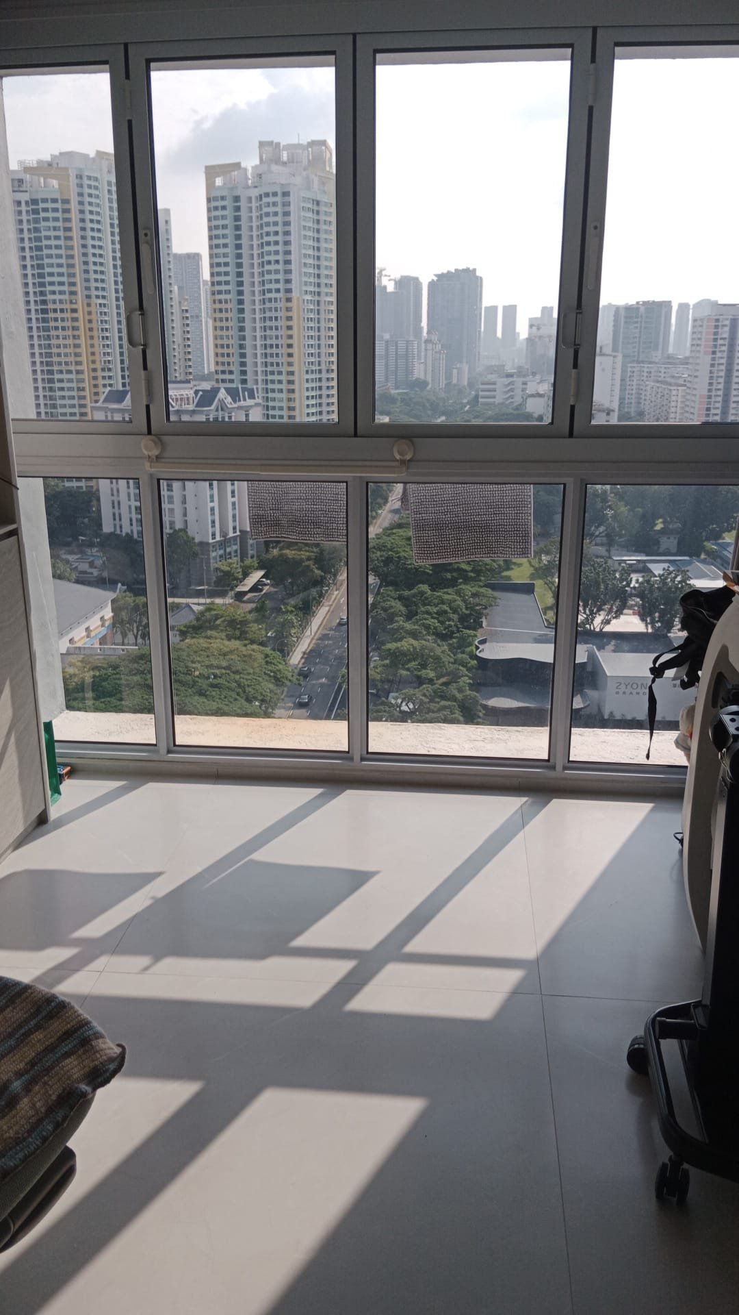 Sunolite window film installed, HDB balcony city view
